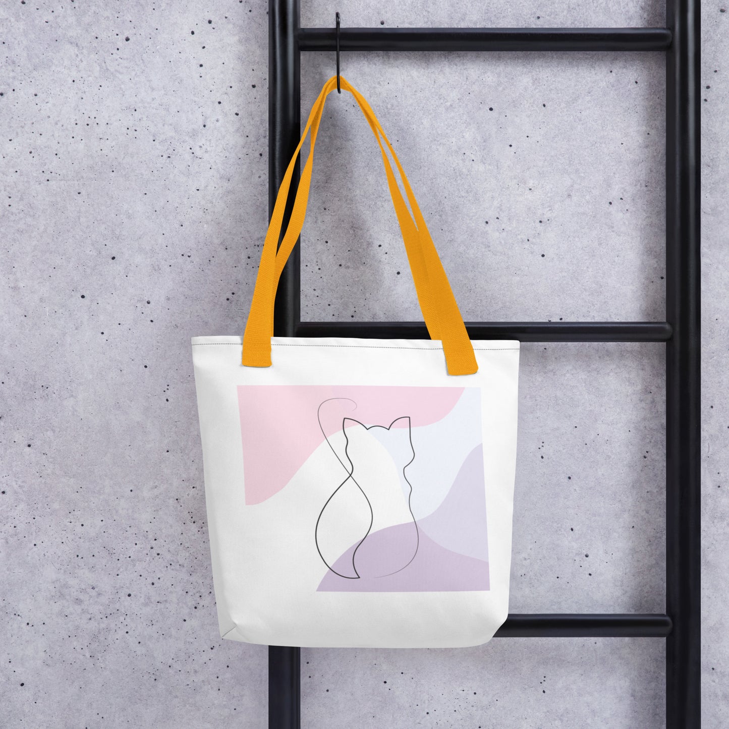 Front View of a tote bag with a design of a cat outline. Yellow Handle.