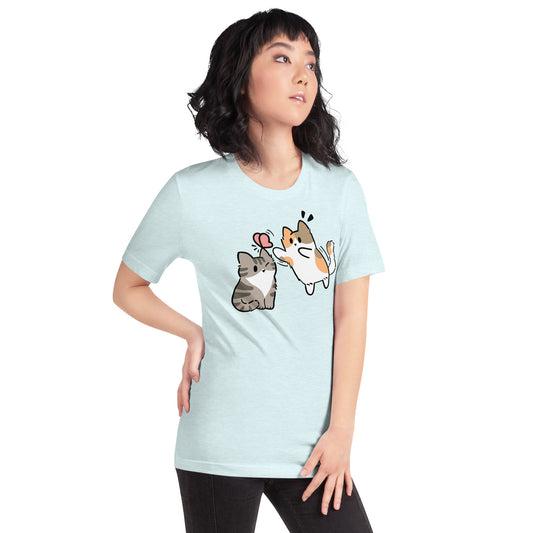 Woman wearing a sky blue Playing With Butterflies Cat T-Shirt from Midnight Zoomies.