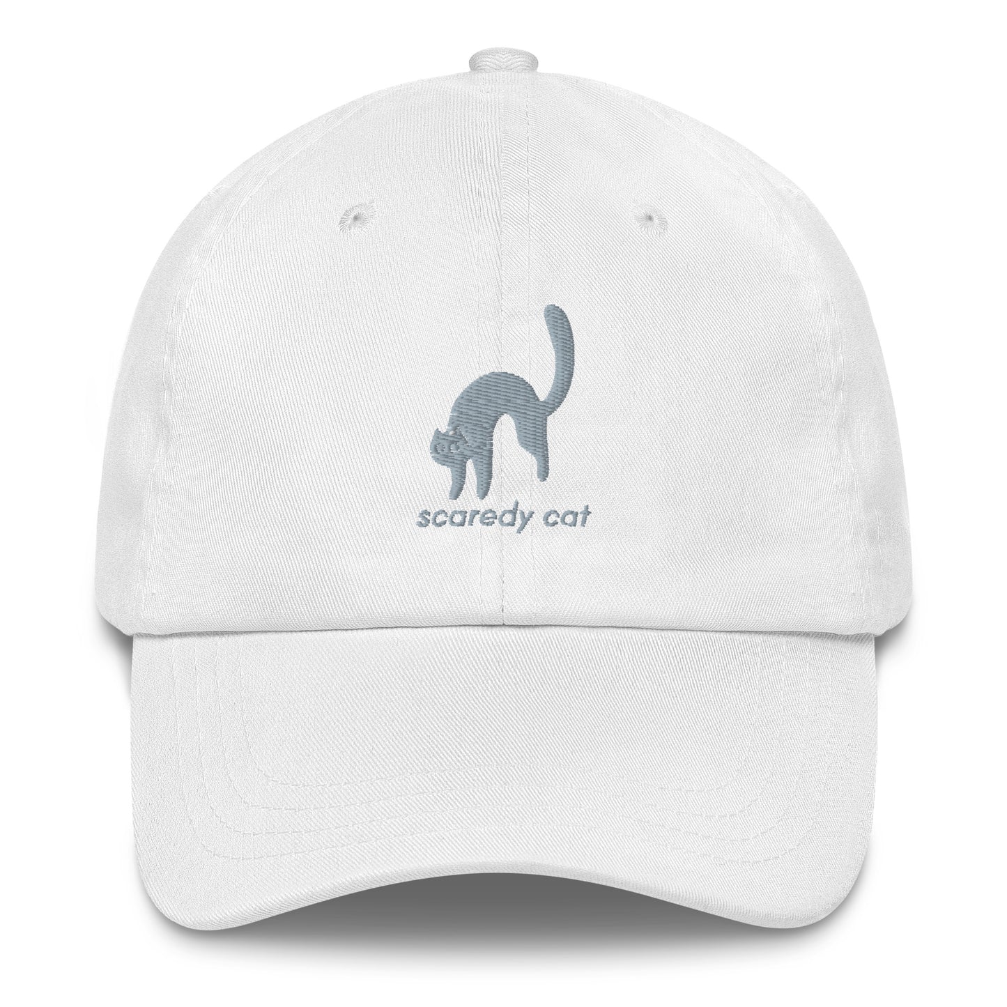 A white cap with a design of a scared cat with the words "Scaredy Cat".