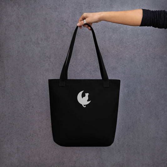 Back View of a black tote bag with a design of two stargazing cats. Black Handle.