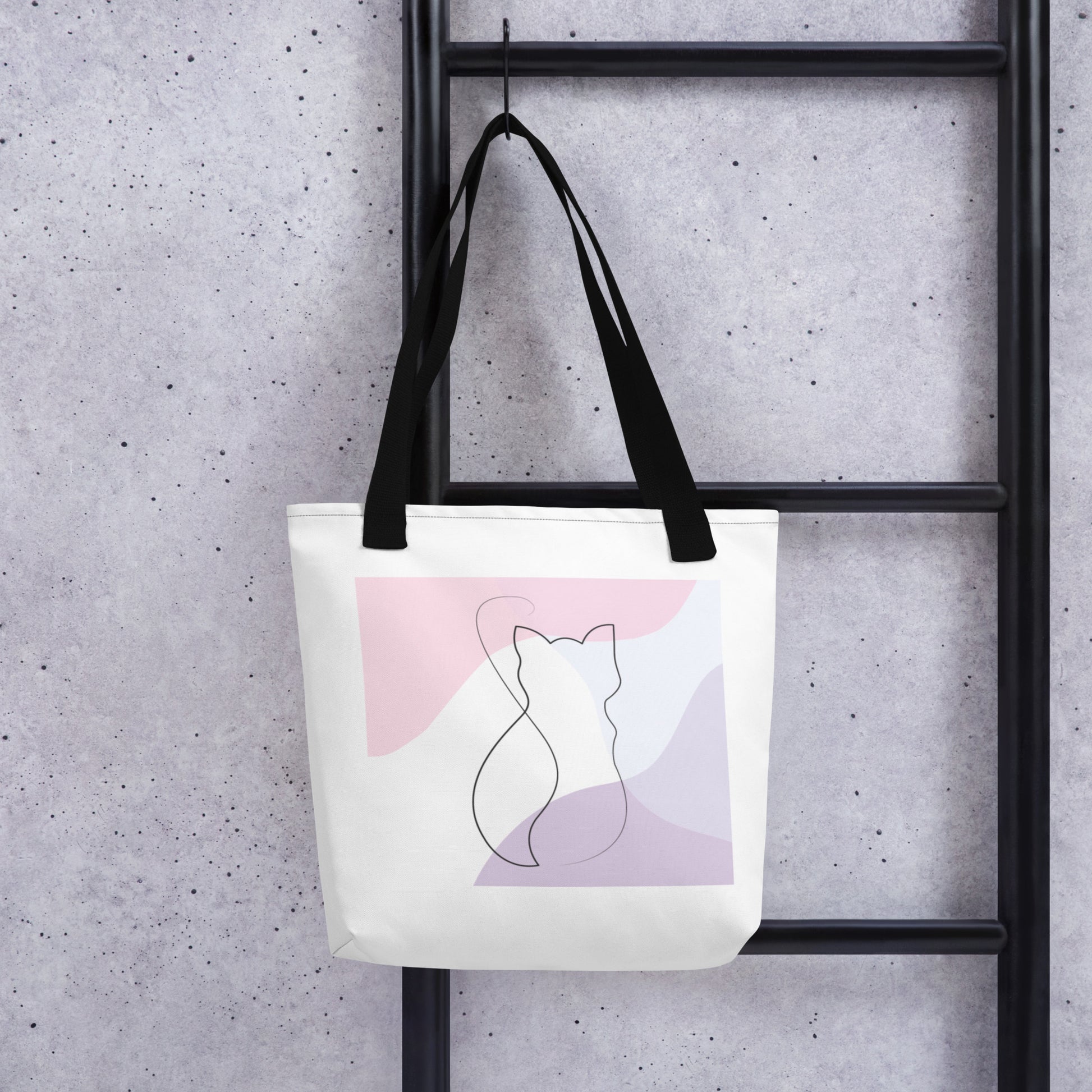 Front View of a tote bag with a design of a cat outline. Black Handle.