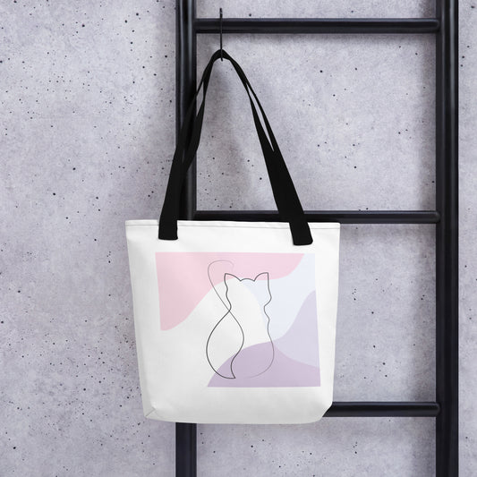 Front View of a tote bag with a design of a cat outline. Black Handle.