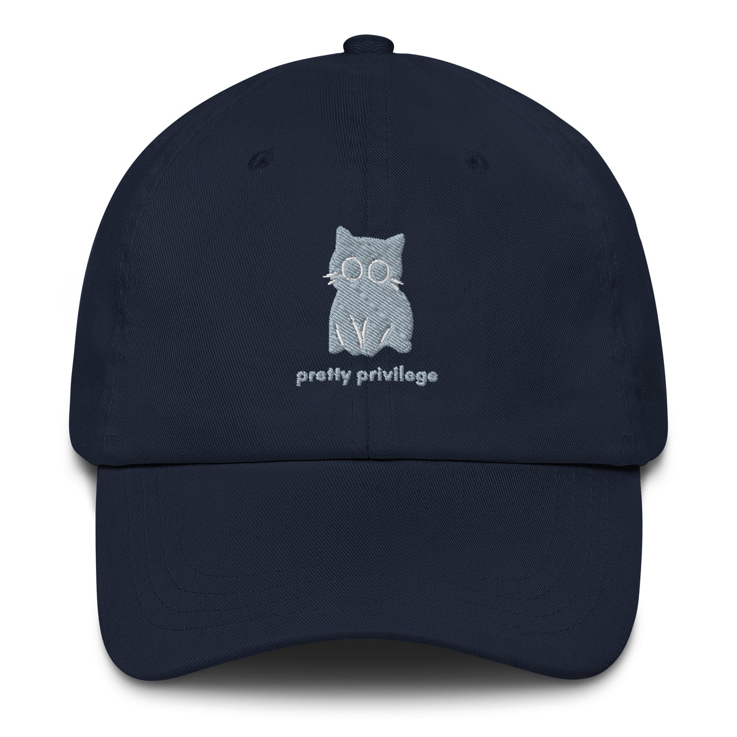 A navy cap with a design of a sitting cat and the words "Pretty Privilege".