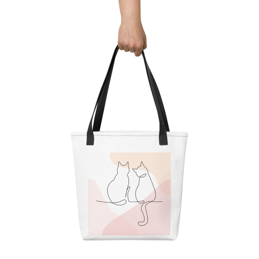 Front View of a tote bag with a design of two cat outlines. Black Handle.